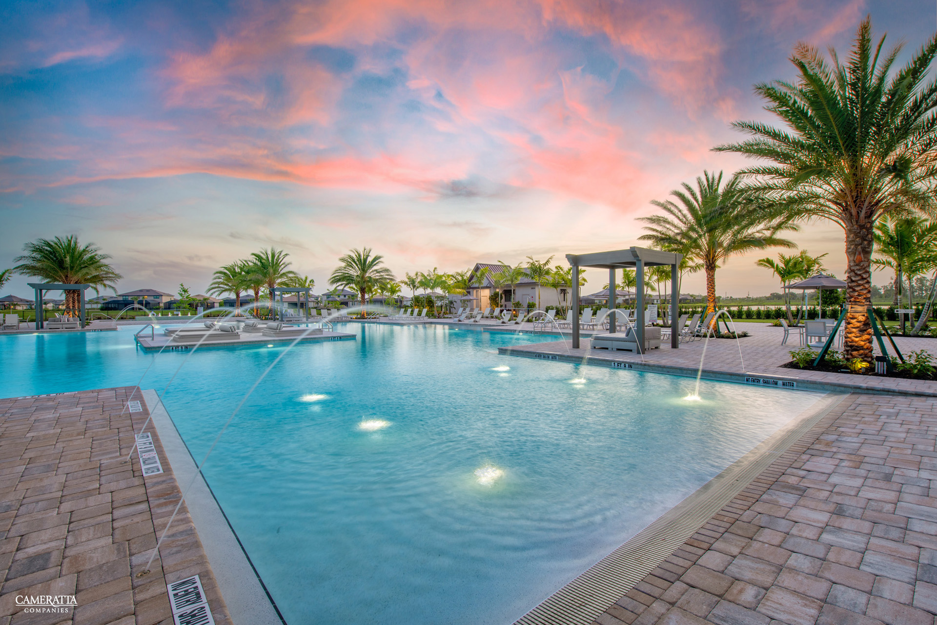 Verdana Village resort pool at sunset